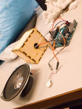 The first version of SID's electronics using an Arduino Uno with the amplifier circuit hidden in a wooden box